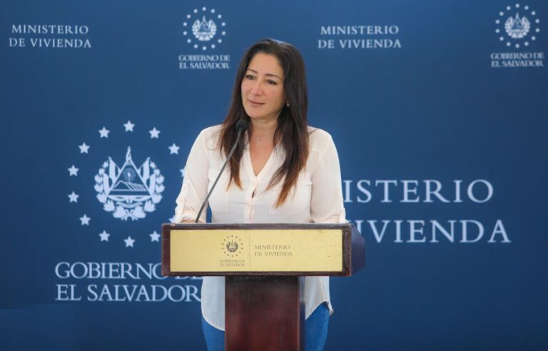 Sol Michala Michelle Sol, the Minister of Housing, delivers property deeds in San ...