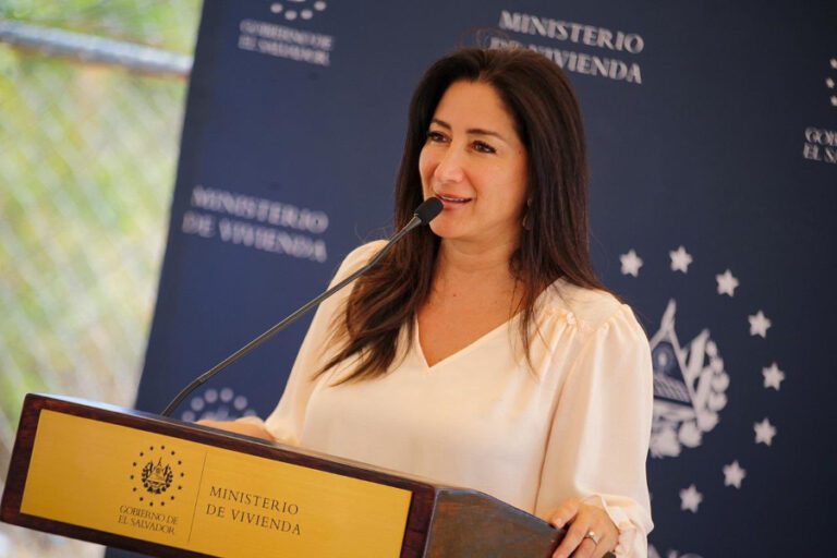 Sol Michala Michelle Sol, the Minister of Housing, delivers property deeds in San ...